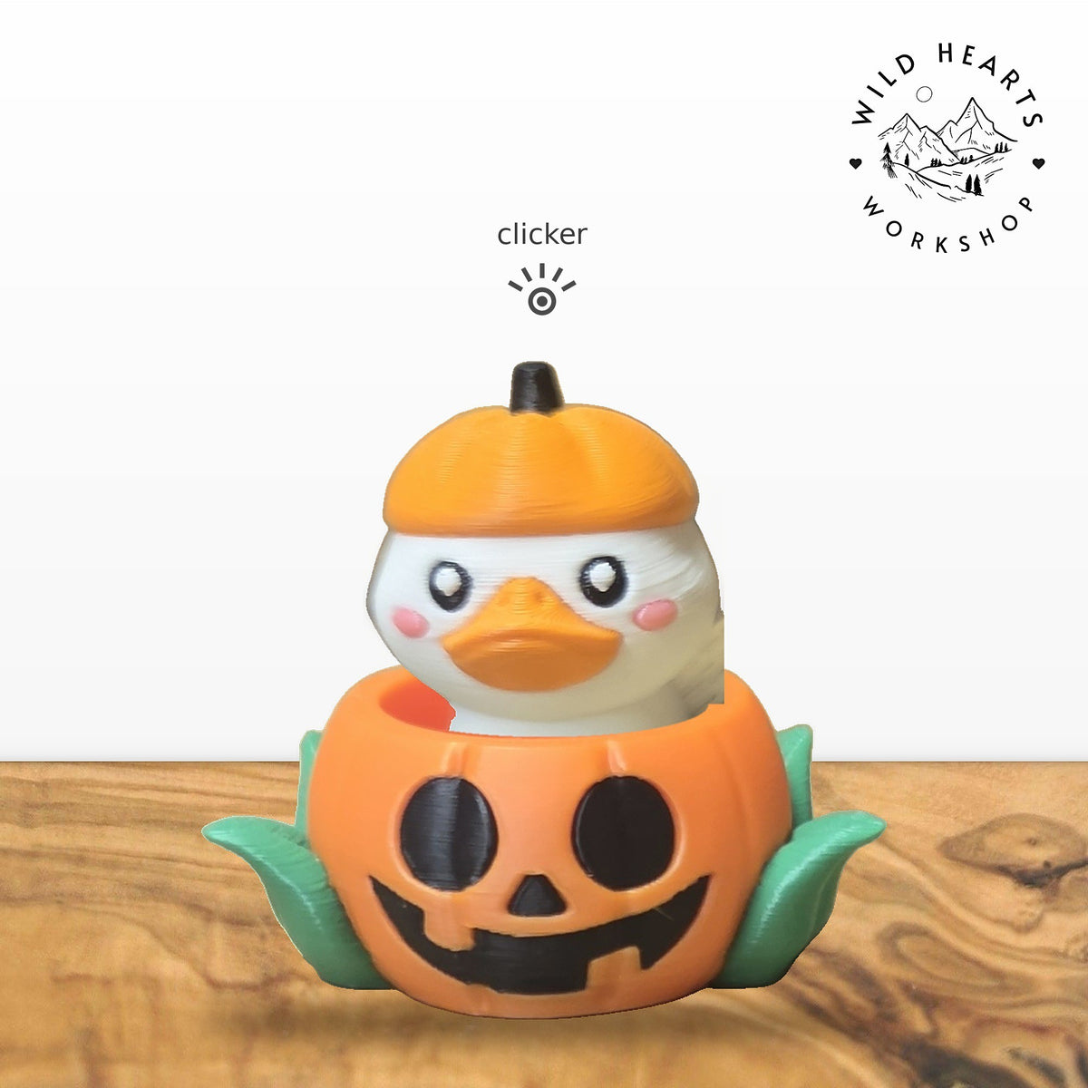 Pumpkin duck clicker top seated in orange jack-o-lantern pot base