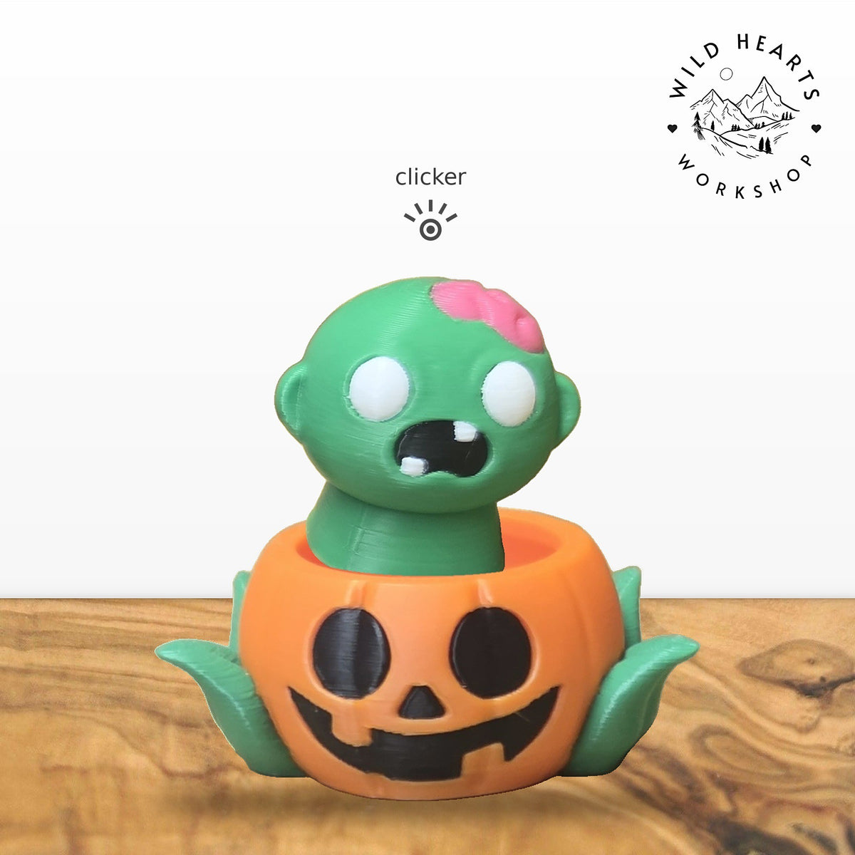 Zombie clicker top (green zombie with pink brain) seated in the orange jack-o-lantern pot with green leaves base